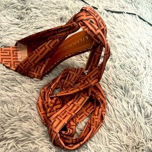 Liliana Hill strap around the leg pointy toed heel.